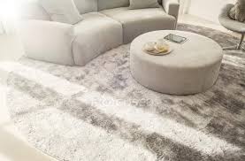 With the correct method, you have to continually switch from working on the front of the piece to working on the back of the piece. Round Rug Under Curved Sofa And Ottoman In Living Room Style Home Stock Photo 199361298
