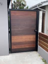 (harwell story) along with our experienced crews, we offer a more artistic, creative approach to every project that we work on. Stained Wood Gate With Powdercoated Steel Frame House Fence Design Wood Gate House Gate Design