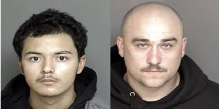 Two arrested during gang-related search warrants