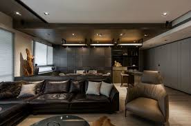 Stone And Wood Make A Dark Masculine Interior Masculine Living Rooms Interior Decorating Living Room Interior Design