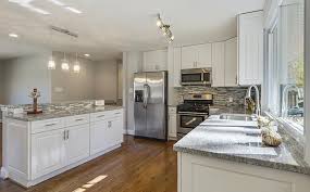 Open Concept Kitchen Design These Gramercy White Cabinets Have A Finished Matching Interior And C Cost Of Kitchen Cabinets Kitchen Design Open White Cabinets