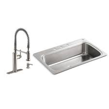 They are securely fastened by the rim which runs along the top edge of the sink. Kohler Vault Stainless Steel 33 Double Bowl Kitchen Sink With Single Faucet Hole K 3820 1 Na Drop In Or Undermount Installation 9 Inch Bowl Kitchen Bath Fixtures Tools Home Improvement