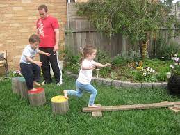Back Yard Obstacle Course Kay The Obstacle Course Is Cool But Look At Those Painted Stumps Kids Obstacle Course Backyard Obstacle Course Backyard For Kids