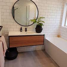I did most of my shower myself (including a glass block i really love the floor and how well it goes with your wood floors. White Subway Tile In Bathroom With Stone Look Floor Tile In 2021 Wood Tile Floors Bathroom Wood Floor Bathroom Interior Design
