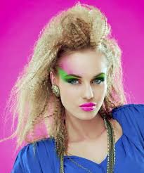 Teased Blonde Hair Messy And Voluminous Worn By A Young Woman With Neon Colored Make Up 80s Costumes 1980s Makeup And Hair 1980s Makeup 80s Makeup Trends