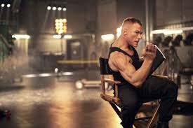 Jcvd is back, doing the splits, and kicking people while wearing so many different wigs. Jean Claude Van Damme The Muscles From Brussels Travel Tomorrow