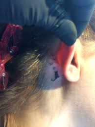 Dog paw tattoo behind ear. Cute Kitty And Paw Print Tattoo Behind The Ear Cat Tattoo Cat Face Tattoos Picture Tattoos