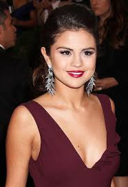 What Does Selena Gomez S New Back Tattoo Mean Tv Guide