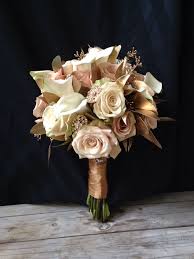 Create beautiful, permanent floral arrangements, wedding bouquets or centerpieces with our wide selection of silk flowers and plants. Classic Rose Bridal Bouquet In Antique Shades With A Touch Of Gold Eucalyptus Brooches Added For Glam Floral Rose Bridal Bouquet Bridal Bouquet Floral Wedding