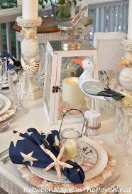 Nautical Tablescape With Shell Chargers And Fish Flatware Nautical Table Table Decorations Beach Table