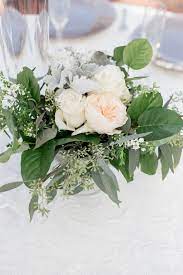 A Petite Table Arrangement Of Juliette Garden Rose Vendela Roses Dusty Miller Seeded Eucalyp Garden Roses Centerpiece Wedding Flowers Eucalyptus Centerpiece