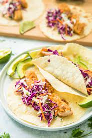 Top each tortilla with cabbage, fish, and slaw. Healthy Blackened Baja Fish Tacos Kim S Cravings