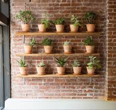 17 Most Creative Ways For Creating Vertical Planter Display In The Home Wall Planters Outdoor Brick Wall Gardens Garden Shelves
