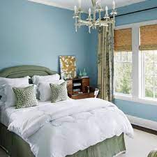 Dark blue grass cloth walls and drapery in an abstract watery blue and ivory pattern lend softness to the space. 24 Stunning Blue Bedroom Ideas