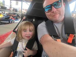 Child learning to ride stacyc bike