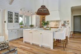 In this sitting area nook, the shiplap accent wall brings the whole space together. White Beach Style Kitchen With Shiplap Home Bunch Interior Design Ideas