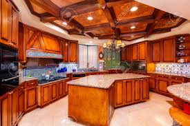 Get high level of information! Beautiful Luxury Home Kitchen With Red Cherry Wood Cabinets Stock Photo Picture And Royalty Free Image Image 121635877