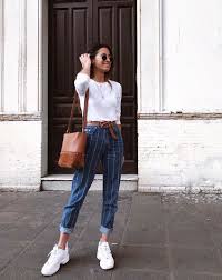 This Is How It Girls Are Wearing Fila Right Now Whowhatwear Com Fila Outfit Fashion Clothes For Women