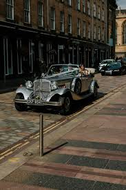Our Real Bride Suzanne Arrives In Style To Her Merchant City Wedding Venue In A Showstopping Silv Vintage Car Wedding City Wedding Venues Wedding Car
