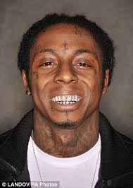 This may be a stupid question but are the little diamond like things on his teeth like glued. As Madonna Brandishes Her Grillz Why Do The A List Insist On Sinking Their Teeth Into The Bizarre Mouth Bling Lil Wayne Lil Wayne News Rapper Lil Wayne