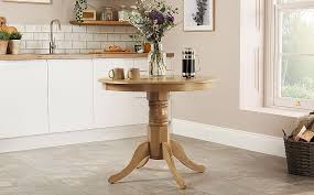 A round oak pedestal table and four chairs. Kingston Round Oak Dining Table With 2 Chester Chairs Ivory Leather Seat Pads Furniture And Choice