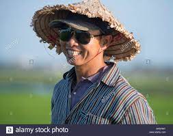 A Vietnamese Man Wearing A Traditional Straw Hat And Baseball Cap Near Hoi An Quang Nam Province Vietnam Southeast A Vietnamese Man Straw Hat Southeast Asia