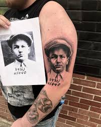 On the inner side of his right arm, there is a portrait of a lady along with a baby's face inked. Baby Face Nelson By Lee For Bookings And Information Please Contact Baby Face Nelson Rocky Mountain Tattoo Mountain Tattoo