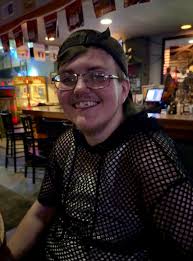 Adorable Yorkie in plaid shirt outfit