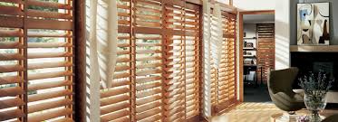Shutters provide privacy when needed or partial light through the louvers the rolling shutters above are on 3 tracks covering a triple panel glass door, two shutters per door panel. Sliding Shutters Window Shutters For Sliding Glass Doors