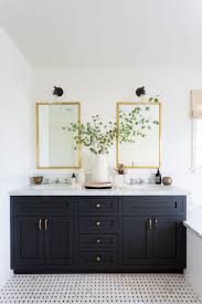 How A Young Couple Infused Their Colorful Personalities Into A Neutral La Home White Bathroom Inspiration White Bathroom Paint Black Cabinets Bathroom