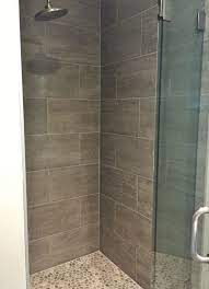 Master Shower 12x24 Porcelain Tile On Walls Pebbles On Floor Tile Bathroom Shower Wall Tile Master Bathroom