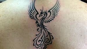 Phoenix tattoos are at their finest when they're big, expansive, and able to wrap around multiple areas of your body. Phoenix Tattoo Meaning Youqueen