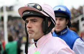 Jockey Jack Kennedy clings to his horse but gets back in the saddle and  amazingly goes