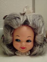 Miniature bathroom tissue holder from 1995