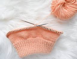 This knitting pattern is for the double brim knit pom pom hat. Ribbed Double Brim Knit Hat Free Pattern