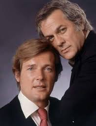 Tony Curtis & Roger Moore, an unlikely pairing but it worked well in ' The  Pursuaders ' with help from a fabulous theme tune from the great John Barry  , taking time