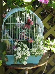 46 Lovely Bird Cage Ideas For Your Garden Birdcage Planter Garden Art Flower Planters