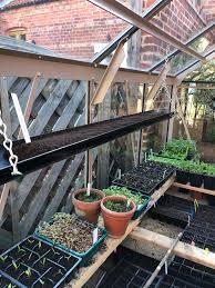 A natural aluminium and red cedar greenhouse staging table is available in four lengths; Rhino Greenhouses Posts Facebook
