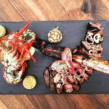 Throwing Down The Hatchet 40oz Bone In Tomahawk Ribeye Chimichurri Marinated Lobster W Ginger Aioli And Crispy Sha Crispy Shallots Tomahawk Ribeye Ribeye