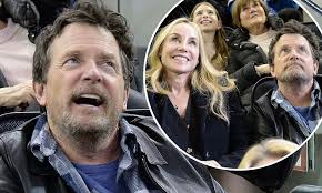 Michael J Fox dresses down as he joins beloved wife Tracy Pollan at a  hockey game in New York