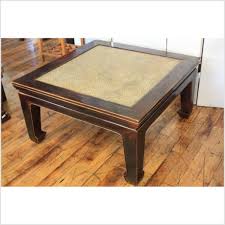 A rattan coffee table can add a touch rustic glamour to any conservatory, and it looks especially great if you have kept the synergy with other rattan furniture pieces in your home or garden. Woven Rattan Top Chinese Coffee Table