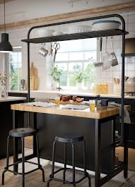 Bar stools can complement a kitchen island table, but they can be uncomfortable and can look out of place if they are too big or too small in proportion to the countertop. Vadholma Kitchen Island Black Oak Width 49 5 8 Ikea Ikea Kitchen Island Kitchen Design Small Kitchen Decor
