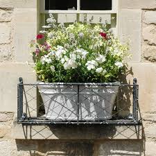 All wrought iron window accents are powder coated in a classic textured black finish to resist rust. Window Boxes Garden Requisites