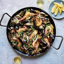 Learn To Make This Seafood Abundant Version Of Classic Paella With Shrimp Mussels Clams And Cockles At F Paella Recipe Seafood Paella Paella Recipe Seafood