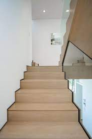Light Wood Stairs Have Been Paired With White Walls And Glass For A Contemporary Look In This Home Interior Stairs Interior Staircase Home
