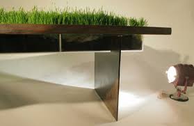 Whether you're searching for the perfect flower pot to showcase an orchid, planter boxes to decorate for the season or utilitarian clay pots to stock a planting table for spring starters, you can find all the options at lowe's. Table With A Planter Through Its Middle Digsdigs