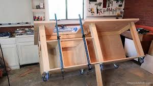 3″ table top lip over hang for clamping to table; Remodelaholic Table Saw Workbench Building Plans With Rockler T Track System