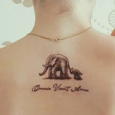 More images for elephant back tattoo » Mother Elephant With Baby Elephant Tattoo On Upper Back