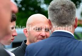 39479380-Former Hartlepool United assistant manager Eddie Kyle joins  mourners as they make their way from Holy Trinity Church Seaton Carew after  the funeral service of former Hartlepool United player