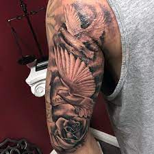 A design that pictures birds flying in the clouds usually represents the urge of the bearer to reach his or her goals. 50 Dove Tattoos For Men Soaring Designs With Harmony